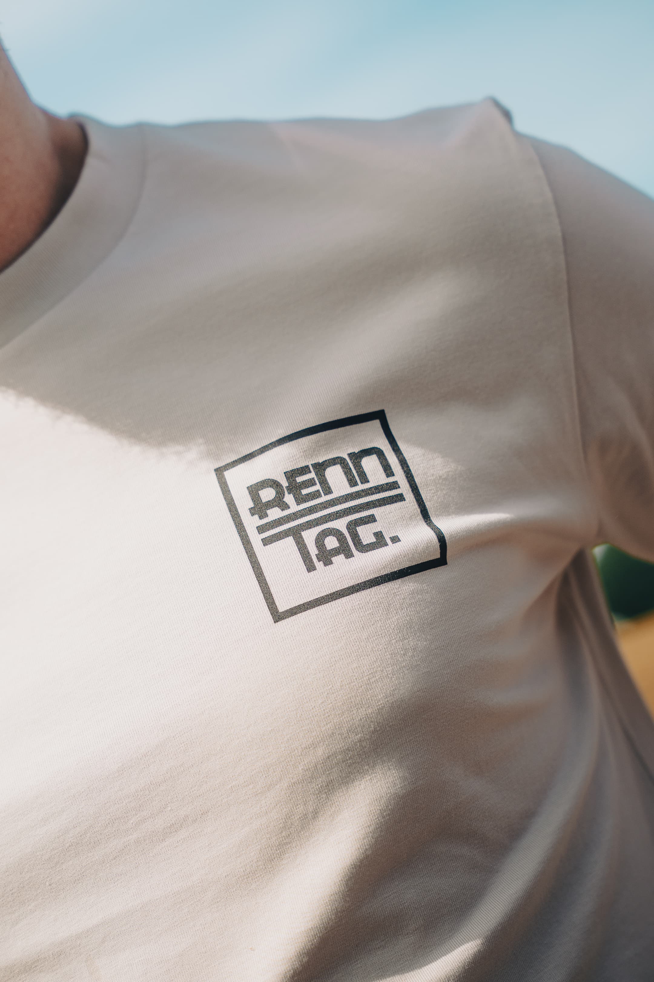 Renntag T-Shirt - Bone - close-up of the renntag box logo on the chest of the bone t-shirt