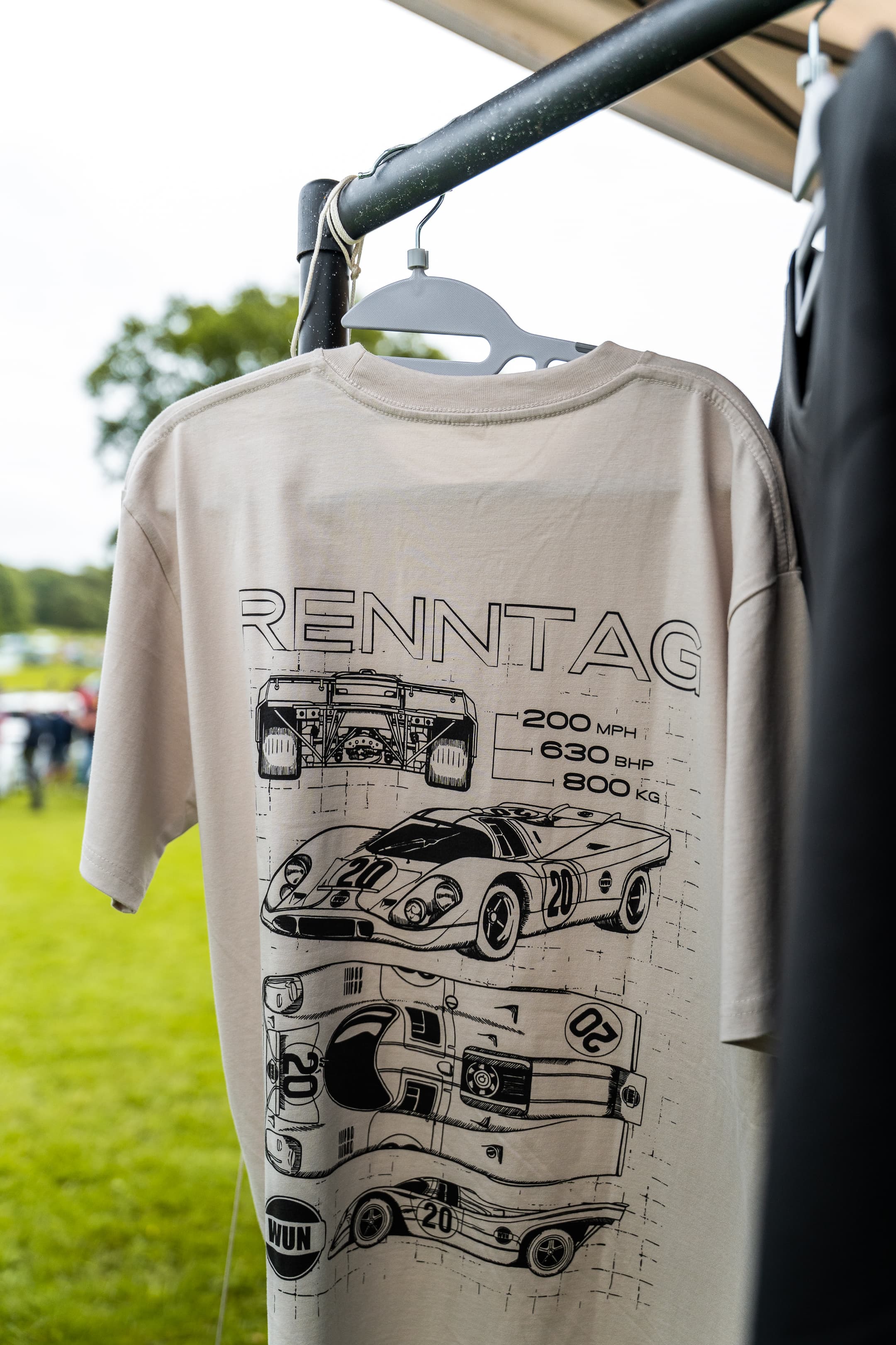 A cream Renntag T-shirt on a hanger at a Wheels Up North event