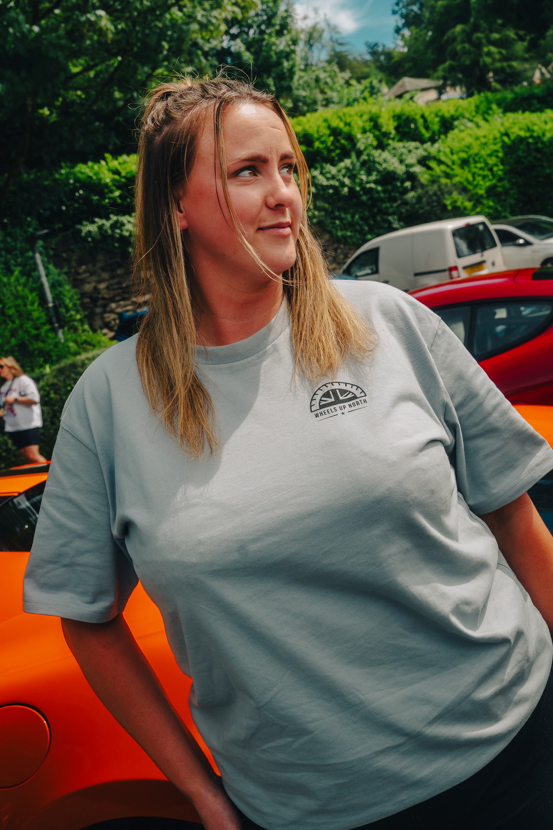 WUN Club T-Shirt - Blue - woman wearing the blue wun club t-shirt with the chest logo