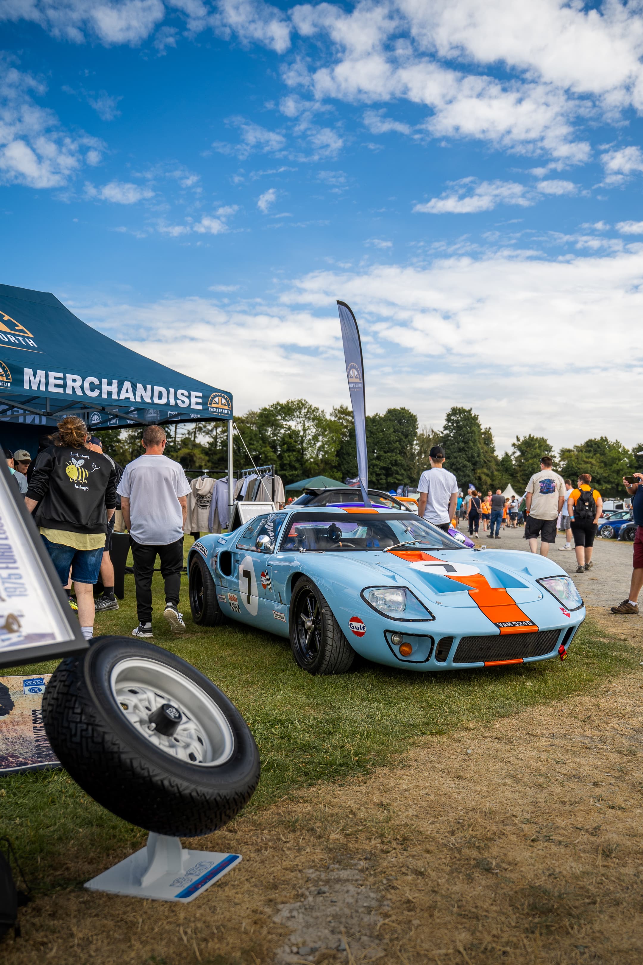 A blue and orange Gulf-liveried Ford GT40 parked at a WUN event
